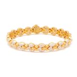 A TWO-COLOUR GOLD AND DIAMOND BRACELET