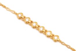 A GOLD AND DIAMOND BRACELET