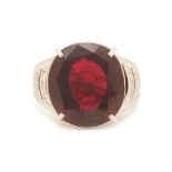 A GARNET AND DIAMOND RING