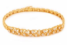 A GOLD AND DIAMOND BRACELET