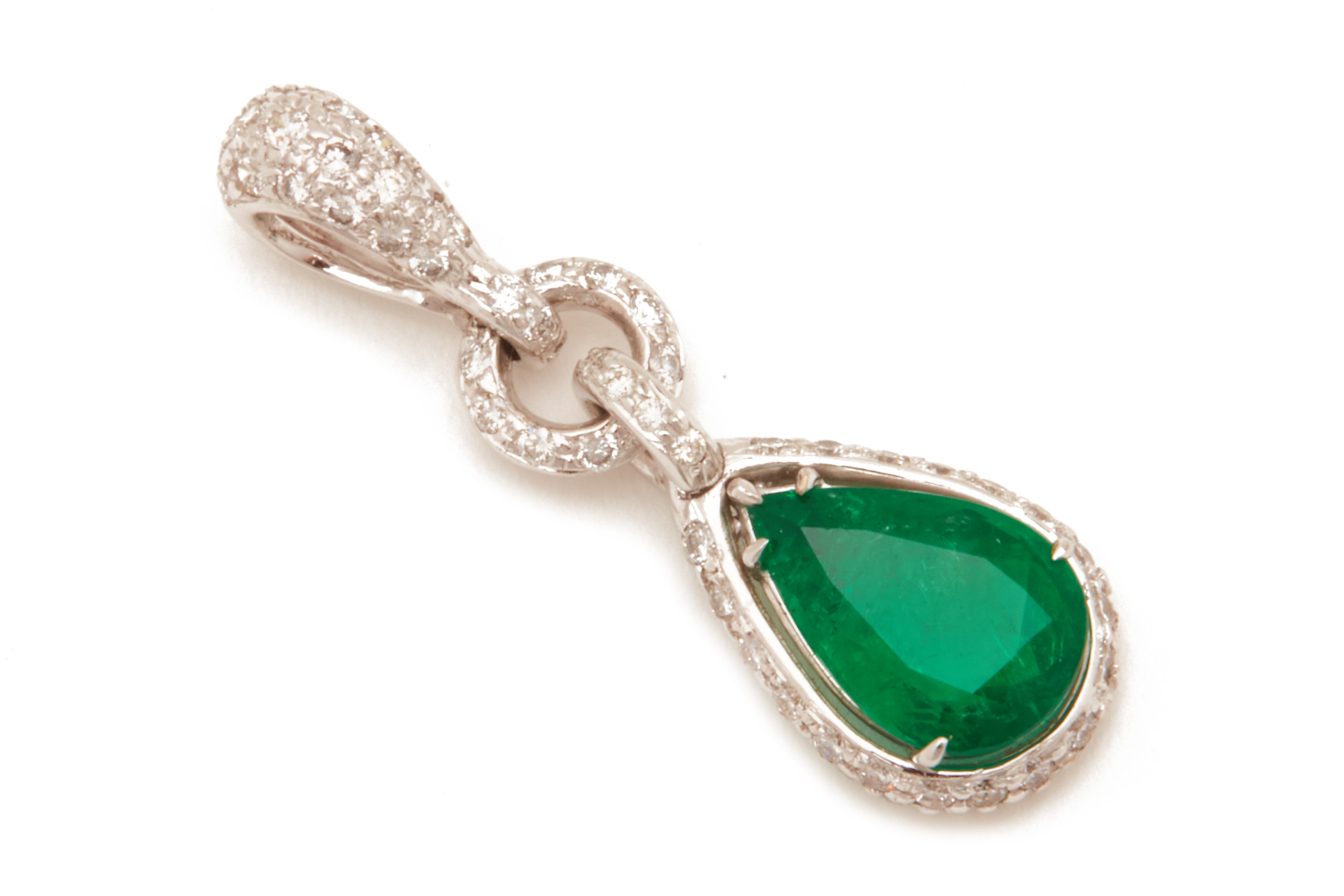 AN EMERALD AND DIAMOND PENDANT