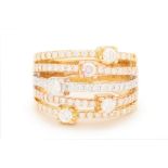 A THREE COLOUR GOLD STACKED DIAMOND RING