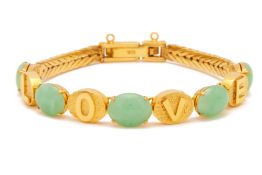 A GOLD AND JADE BRACELET