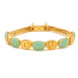 A GOLD AND JADE BRACELET