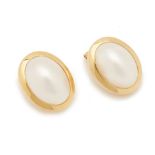 A PAIR OF OVAL MABE PEARL EARRINGS