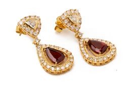 A PAIR OF GARNET AND DIAMOND DROP EARRINGS