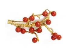 A CORAL AND DIAMOND NATURALISTIC BROOCH