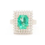 AN EMERALD AND DIAMOND RING