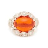 A FIRE OPAL AND DIAMOND RING