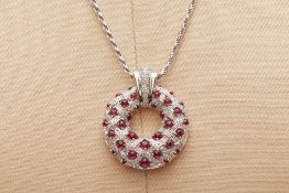 A RUBY AND DIAMOND PENDANT ON CHAIN