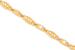 A GOLD AND DIAMOND BRACELET