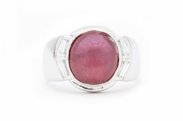 A CABOCHON RUBY AND DIAMOND RING