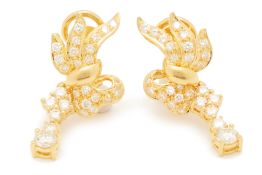 A PAIR OF BOW SHAPED DIAMOND EARRINGS