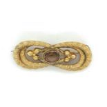 Yellow Metal (tests as gold) Brooch with central stone - 45mm x 18mm - 4.8 grams.