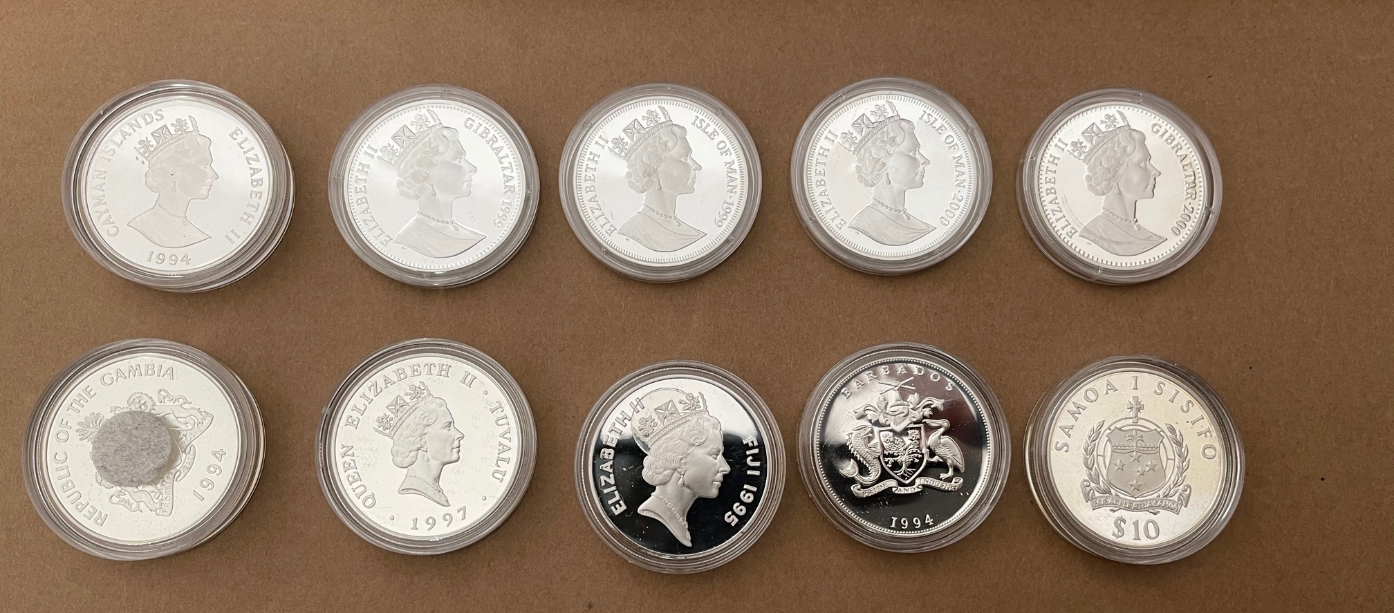 Lot of 10 Queen Mother Silver Proof Coins for Various Countries.