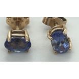 Pair of 14 karat Gold and Tanzanite Earrings - colour purple/blue Oval stones 1ct in total.