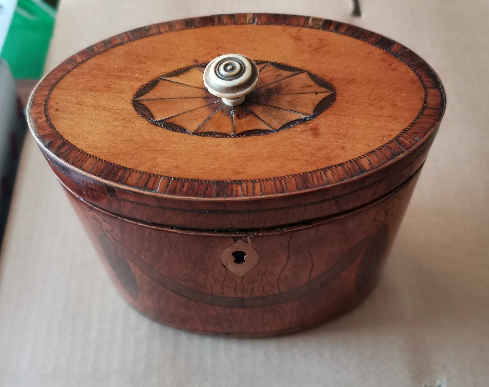 Antique Oval Tea Caddy - 6"wide x 5 1/4" tall x 3 1/4" deep.