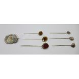 A Victorian brooch and six stick pins including silver