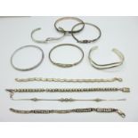 Six silver bangles and four silver bracelets, 103g