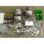 A three piece plated tea service and a collection of plated flatware, some boxed **PLEASE NOTE