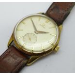 A gentleman's 9ct gold cased Omega wristwatch, the back bears inscription dated 1953