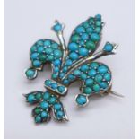 A continental silver and turquoise bead fleur de lys brooch, stamped 800, FB