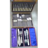 A canteen of cutlery and two cased sets of fish servers