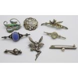 Eight silver brooches