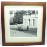 A framed signed photograph of Stirling Moss at Monte Carlo