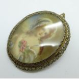 An .800 filigree silver mounted portrait brooch or pendant, 41mm x 49mm