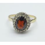 A 9ct gold, garnet and zircon cluster ring, 2.9g, R