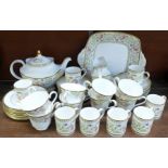 A Royal Doulton Lichfield tea and coffee service, with teapot, cream and sugar, cake plate and eight