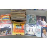 A box of LP and 12" records including Simon and Garfunkel, Shirley Bassey, Wham!, **PLEASE NOTE THIS