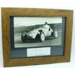 A mounted picture and signature of Stirling Moss in 1951, framed