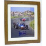 A framed signed photograph of Jackie Stewart