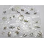 Twenty-five pairs of silver earrings