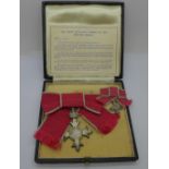 An Order of the British Empire medal and miniature, OBE, with Royal Mint box marked MBE