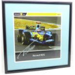 A framed and signed picture of double world champion Fernando Alonso
