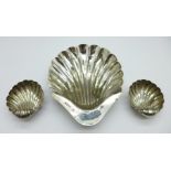 A pair of Victorian silver shell shaped salts, Birmingham 1894, and a similar dish with three