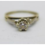 A yellow and white metal set diamond solitaire ring, 3.2g, S