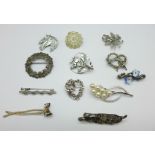 Twelve brooches including silver