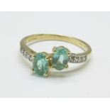 A 9ct gold, green and white stone ring, 2.2g, Q