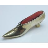 A novelty hallmarked silver pin cushion in the form of a shoe, London hallmark, John Bull Ltd.,