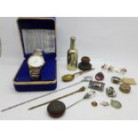 A novelty plated beer bottle shaped pepper, a wristwatch, an aluminium ring, an unmounted compass,