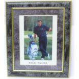 A framed signed picture of Nick Faldo