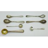 Seven condiment spoons;-one Victorian silver by George Adams, four other silver, one EPNS and one