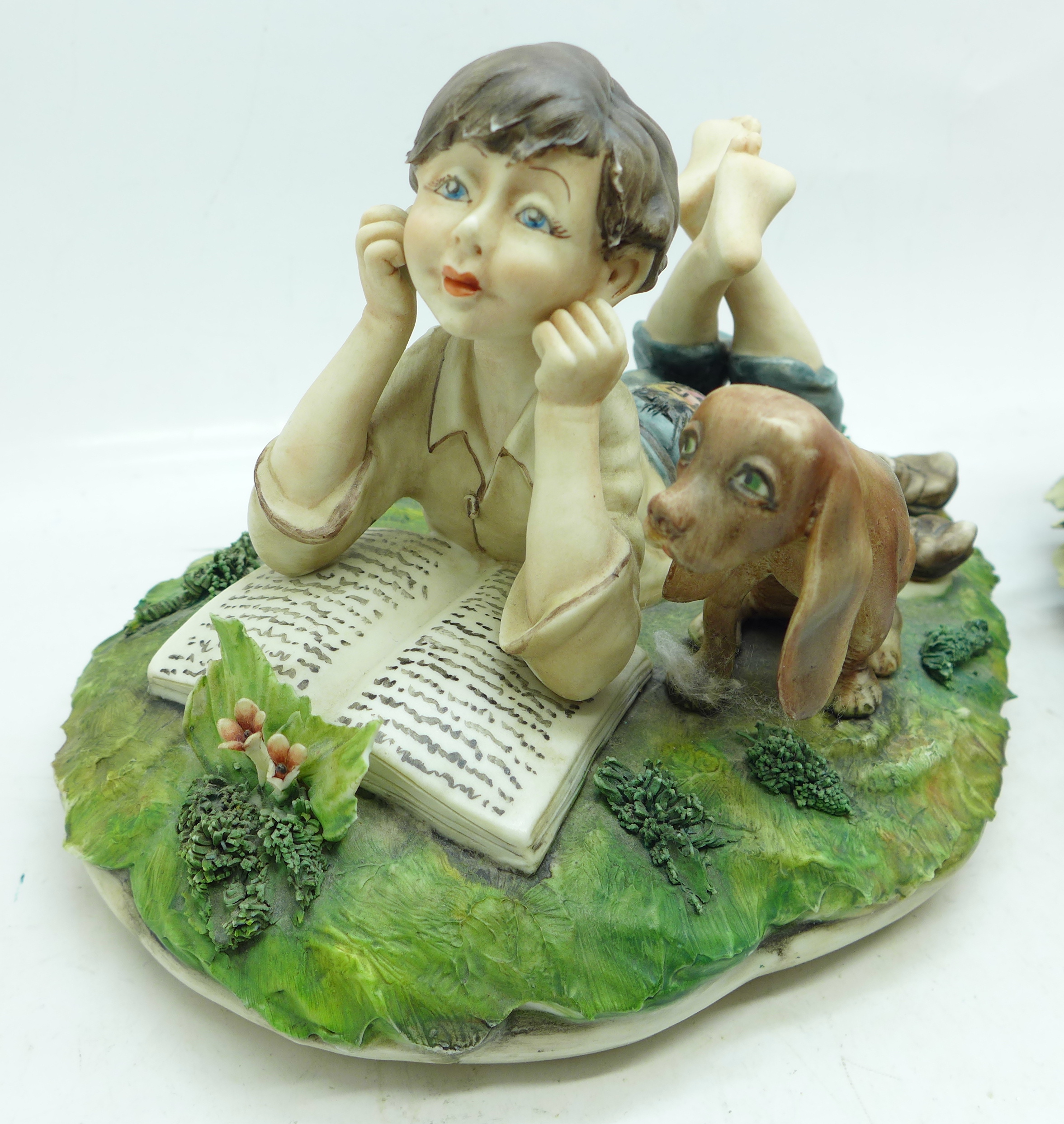 A Capodimonte figure of a boy reading a book with dog, signed Milio on the side, blue crown on the - Image 2 of 7
