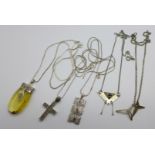 Four silver pendants and chains and a studio silver necklet