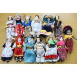 A set of thirteen hand painted porcelain dolls