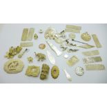 A collection of mother of pearl jewellery and game counters, and other carved jewellery and